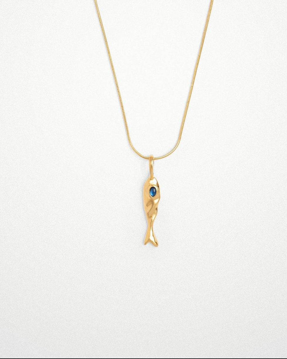 Molten 18k plated and rhodium silver fish-shaped pendant with blue sapphire on a round snake chain 