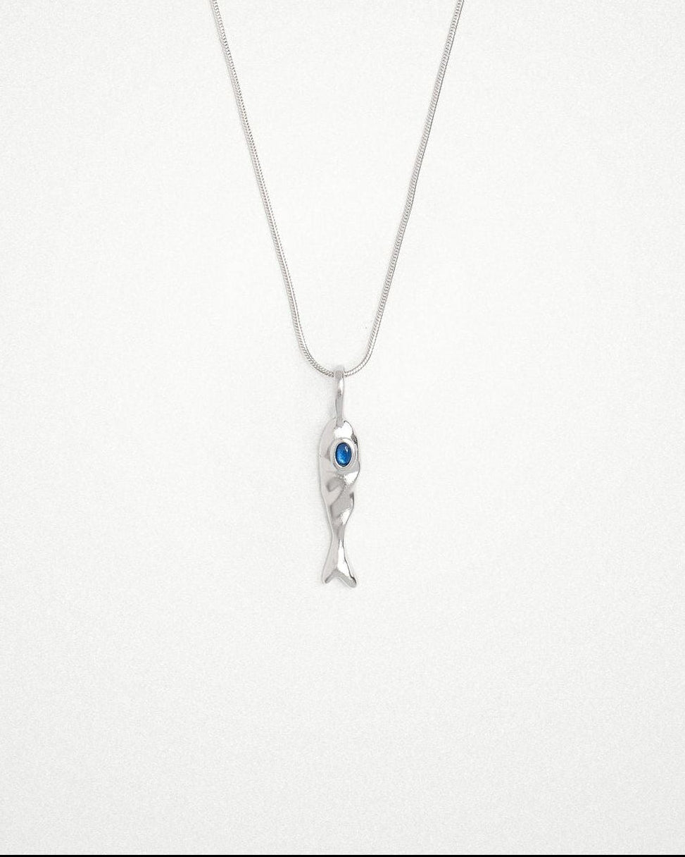 Molten 18k plated and rhodium silver fish-shaped pendant with blue sapphire on a round snake chain necklace
