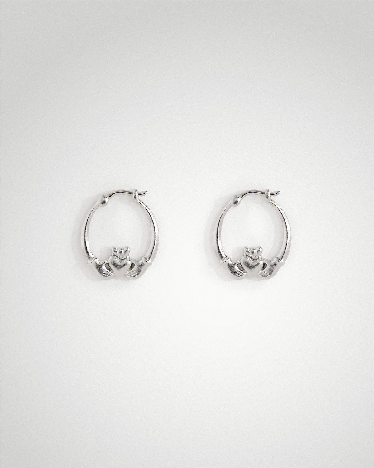 Sterling silver mid Claddagh hoop earrings by Lines &amp; Current