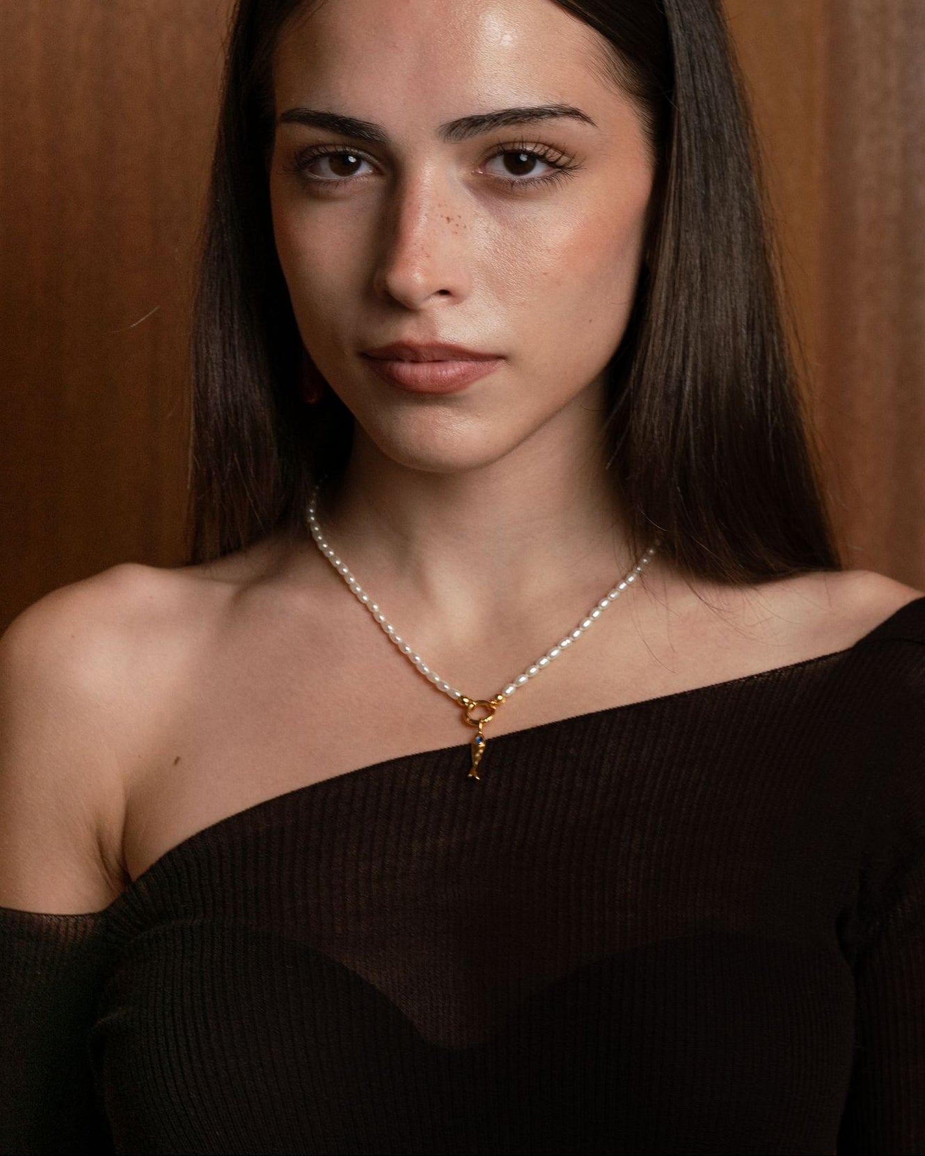Mother of pearl charm holding necklace with central charm holder in 18k gold plating or rhodium plated silver with molten fish charm