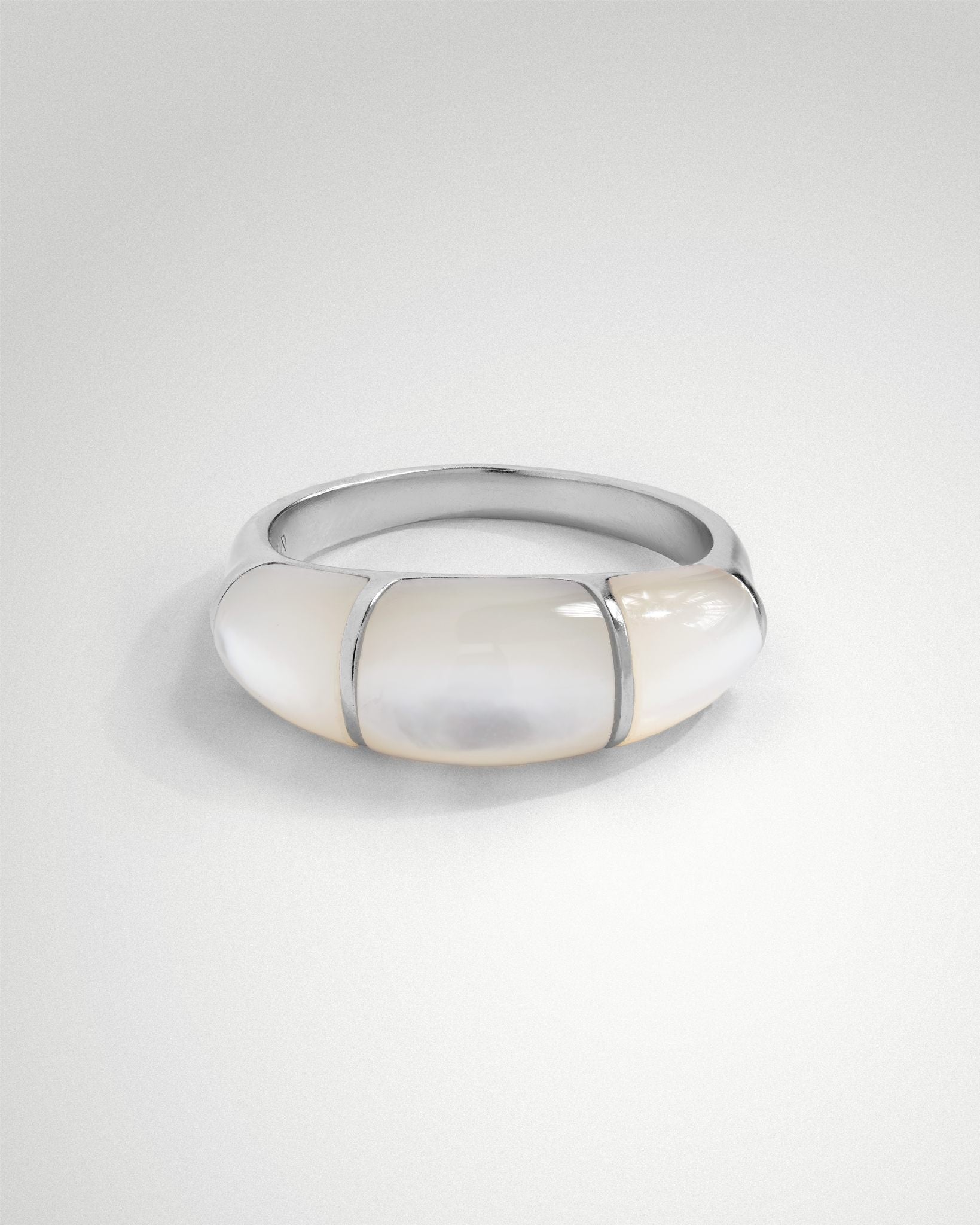 Sigrid dome ring in unpolished rhodium-plated sterling silver, three domed segments raised 5mm, soft shell surface finish.
