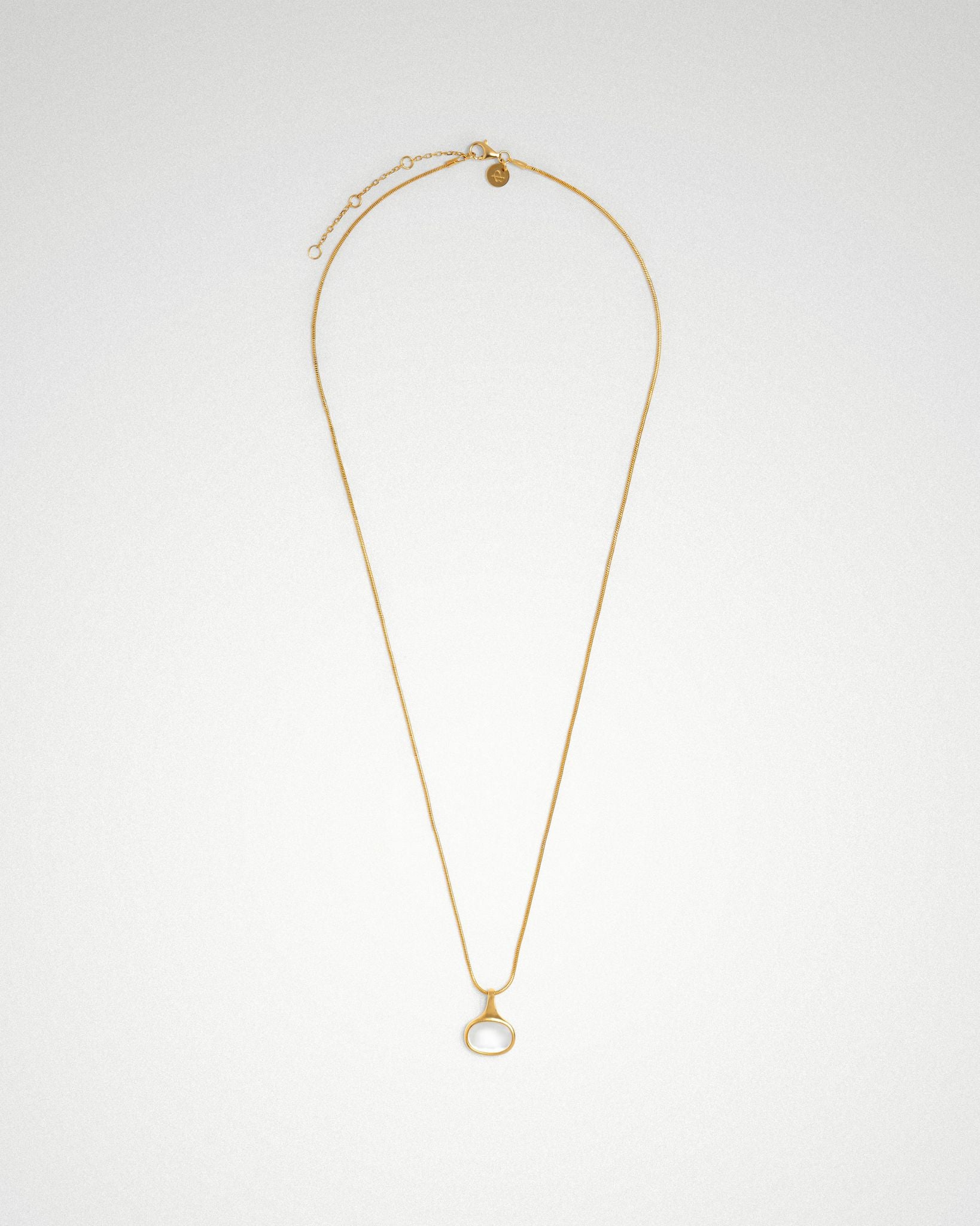 Sigrid oval necklace, sideways shell cabochon on fine snake chain 18k gold plating.