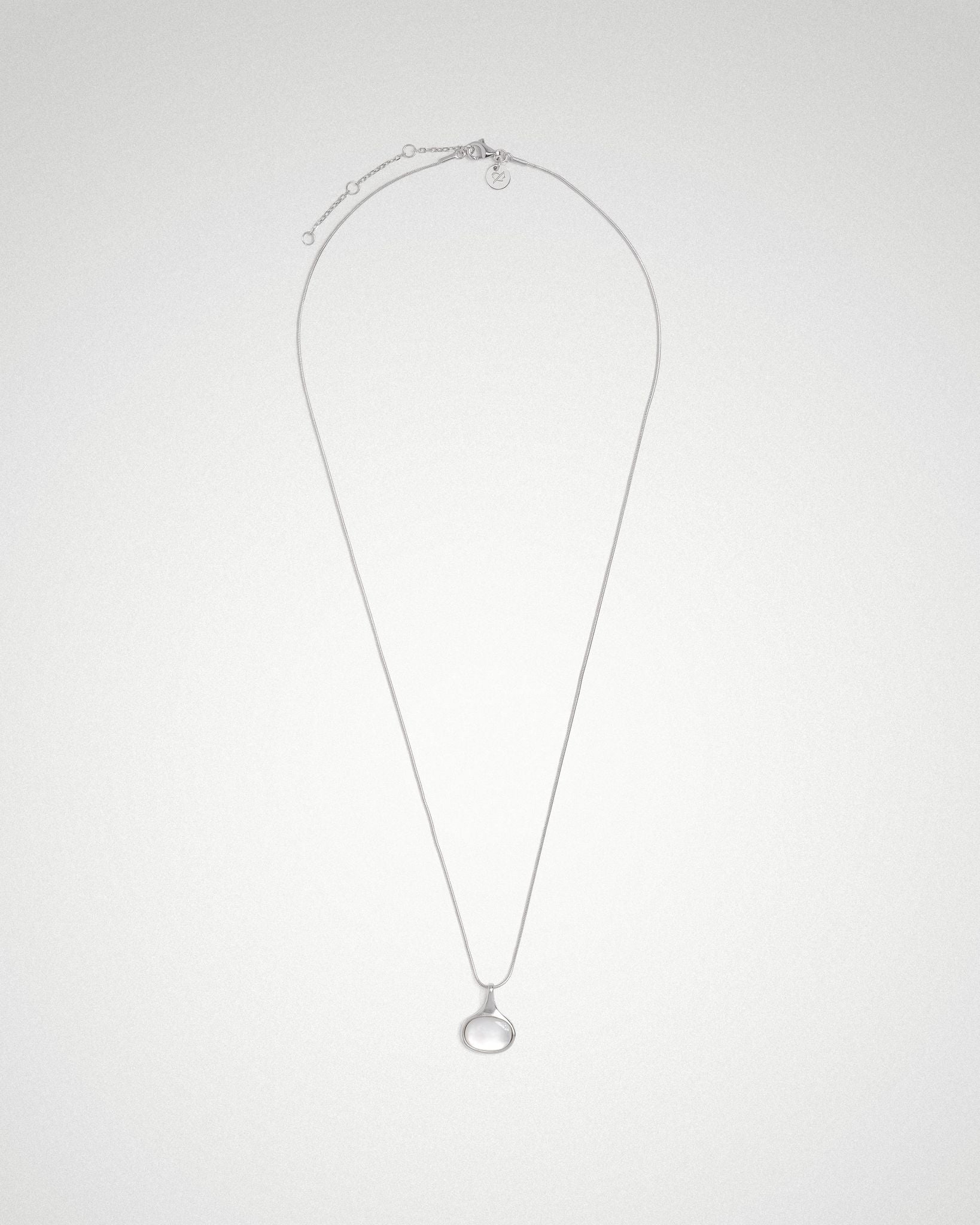Sigrid oval necklace, sideways shell cabochon on fine snake chain, rhodium. 
