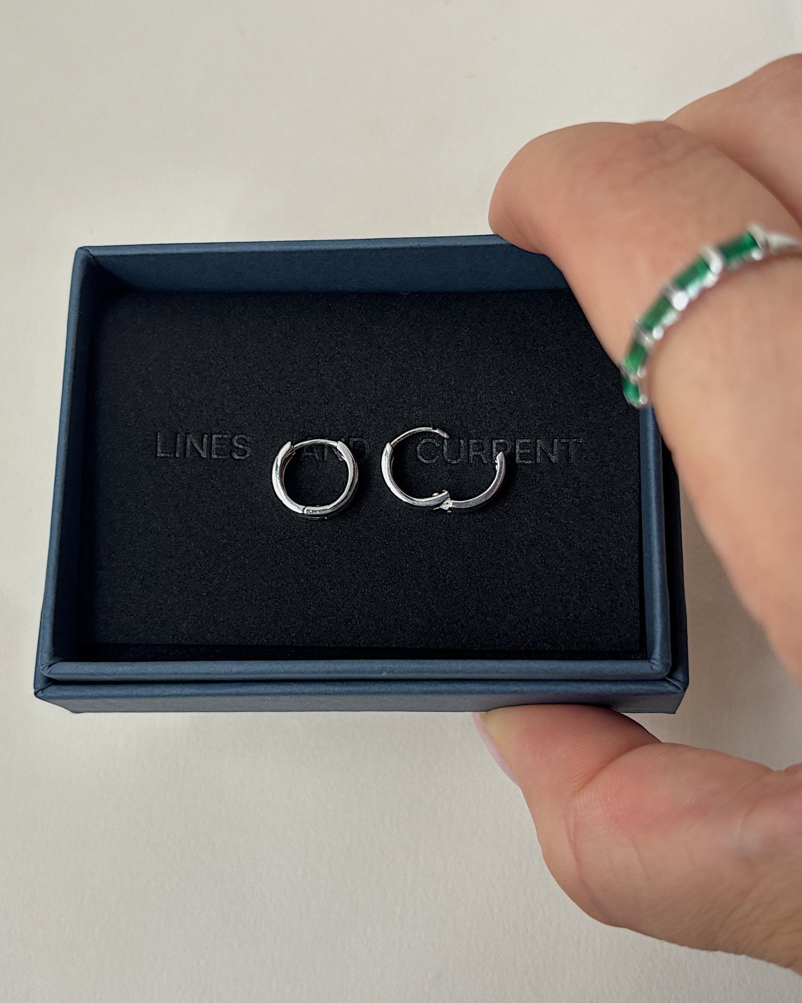 &#39;Finch&#39; Silver Huggie Hoop Earrings - Lines &amp; Current